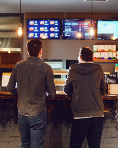QSR in restaurant ordering counter with digital display screens