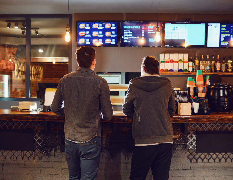 QSR in restaurant ordering counter with digital display screens
